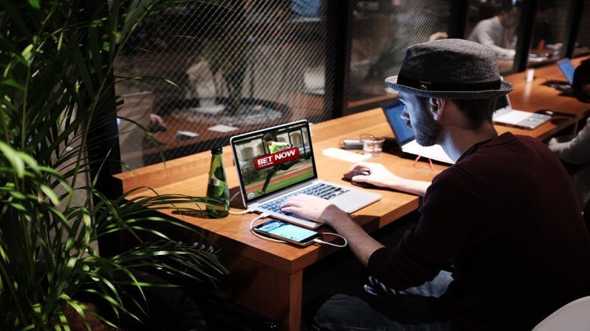 Person Sitting Using Laptop, Sports Betting